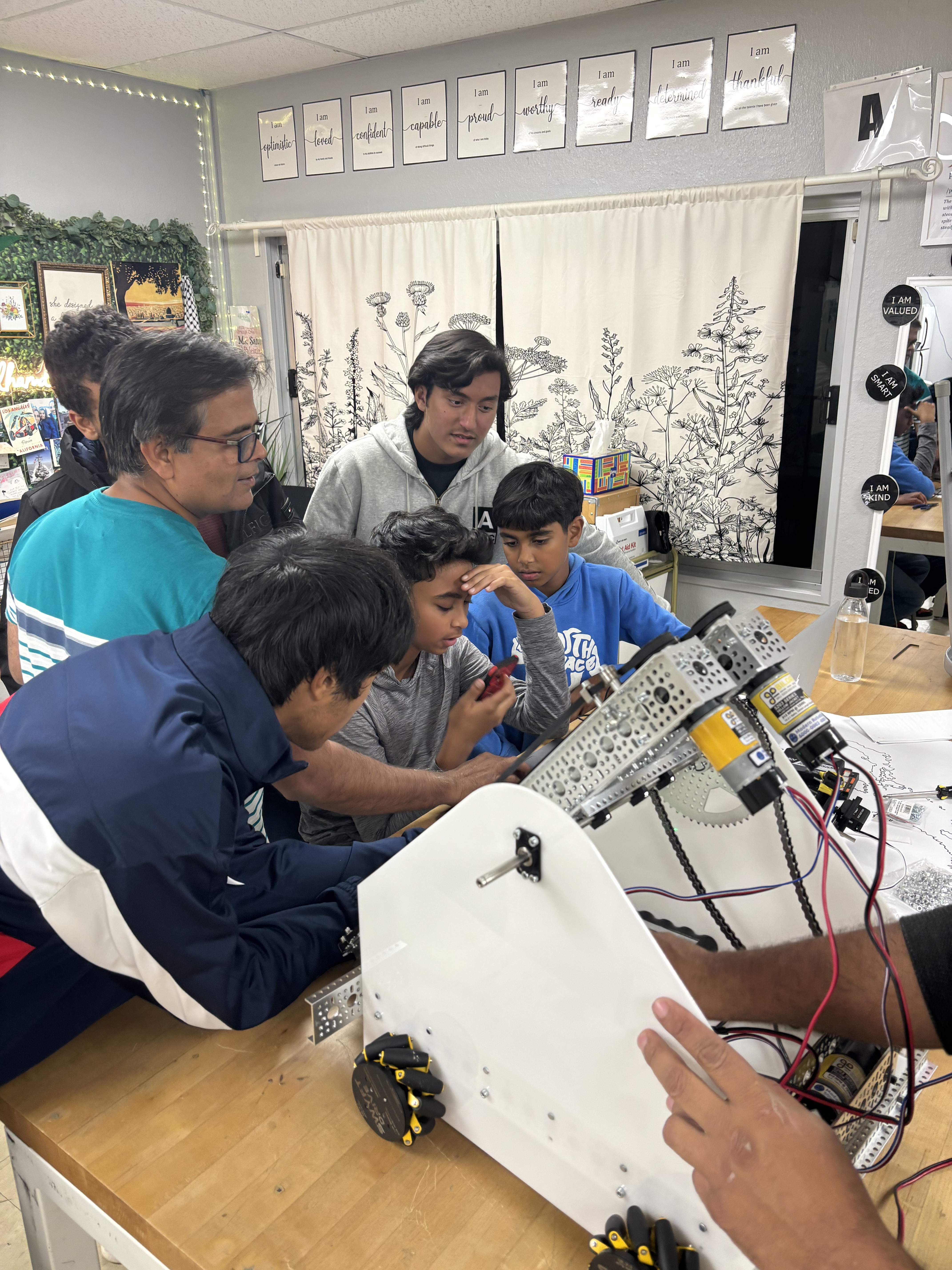 IROC students collaborating on robotics projects and learning STEM skills